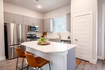 Kitchen with island and chairs